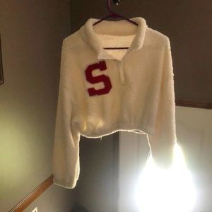 Fluffy white long sleeved red “S” crop top